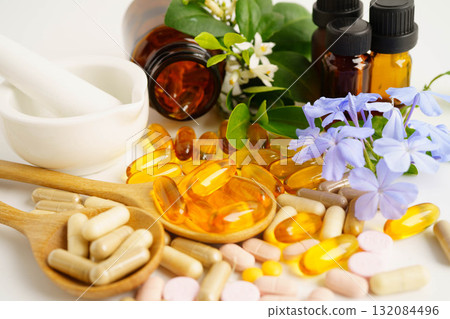 Alternative medicine herbal organic capsule with vitamin E omega 3 fish oil, mineral, drug with herbs leaf natural supplements for healthy good life. 132084496
