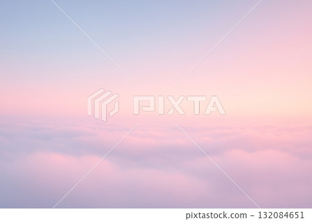 A fantastical horizon above the clouds, bathed in pink and blue light 132084651