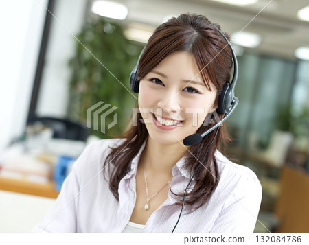 A call center operator with a charming smile 132084786