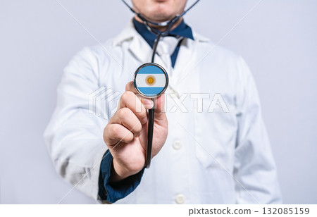 Doctor hands holding stethoscope with Argentina flag. Argentina health and care concept Doctor hands holding stethoscope with Argentina flag. Argentina health and care concept 132085159