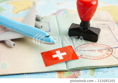 Switzerland,passport with approved stamp on document for tourism to immigration at airport in country. Switzerland,passport with approved stamp on document for tourism to immigration at airport in country. 132085205