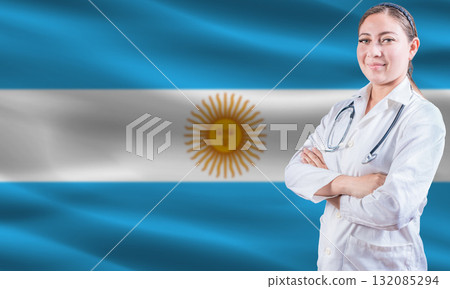 Female doctor on Argentina flag. Doctor with crossed arms on Argentina flag. Argentina health and care concept Female doctor on Argentina flag. Doctor with crossed arms on Argentina flag. Argentina health and care concept 132085294