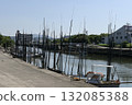 Fishing boats and concrete quays moored at the waterfront in the city 132085388
