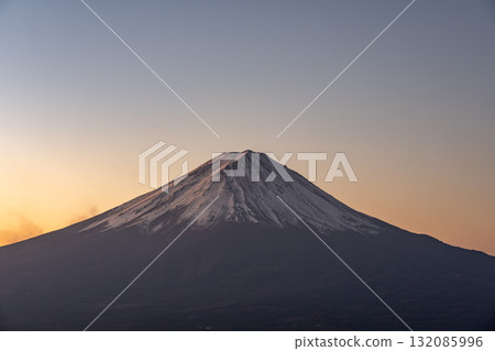 The summit of Mount Fuji dyed in the morning glow The summit of Mount Fuji dyed in the morning glow 132085996