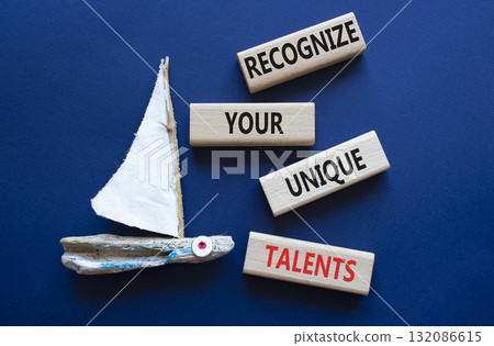 Unique Talents symbol. Concept words Recognize Your Unique Talents on wooden blocks. Beautiful deep blue background with boat. Business concept. Copy space Unique Talents symbol. Concept words Recognize Your Unique Talents on wooden blocks. Beautiful deep blue background with boat. Business concept. Copy space 132086615