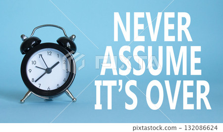 Never assume it is over symbol. Beautiful blue background with alarm clock. Business and Never assume it is over concept. Copy space. 132086624