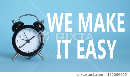 We make it easy symbol. Beautiful blue background with alarm clock with words We make it easy. Business concept. Copy space. We make it easy symbol. Beautiful blue background with alarm clock with words We make it easy. Business concept. Copy space. 132086625