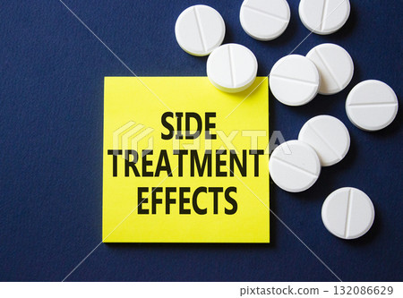 Side Treatment Effects symbol. Concept words Side Treatment Effects on yellow note. Beautiful deep blue background with pills. Healthcare and Side Treatment Effects concept. Copy space. Side Treatment Effects symbol. Concept words Side Treatment Effects on yellow note. Beautiful deep blue background with pills. Healthcare and Side Treatment Effects concept. Copy space. 132086629