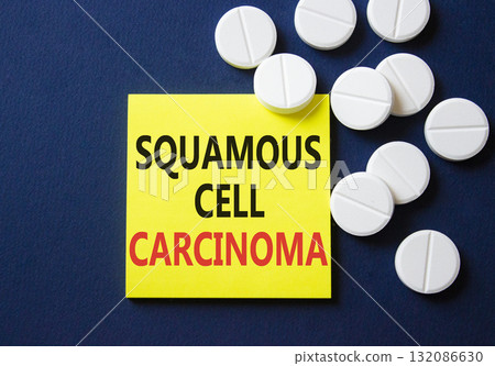 Squamous Cell Carcinoma symbol. Concept words Squamous Cell Carcinoma on yellow note. Beautiful deep blue background with pills. Healthcare and Squamous Cell Carcinoma concept. Copy space. 132086630