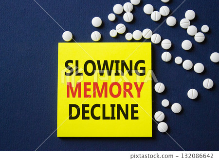 Slowing Memory Decline symbol. Concept words Slowing Memory Decline on yellow note. Beautiful deep blue background with pills. Healthcare and Slowing Memory Decline concept. Copy space. Slowing Memory Decline symbol. Concept words Slowing Memory Decline on yellow note. Beautiful deep blue background with pills. Healthcare and Slowing Memory Decline concept. Copy space. 132086642