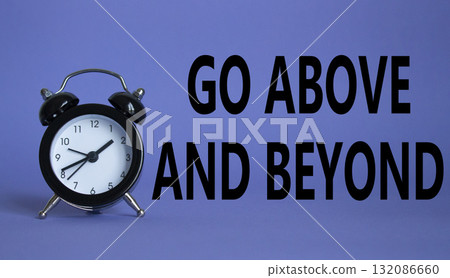 Go above and beyond symbol. Beautiful purple background with alarm clock. Business and Go above and beyond concept. Copy space. 132086660