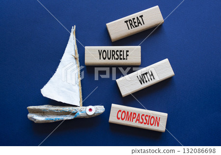 Treat yourself with compassion symbol. Concept words Treat yourself with compassion on wooden blocks with boat. Beautiful deep blue background. Medicine concept. Copy space. Treat yourself with compassion symbol. Concept words Treat yourself with compassion on wooden blocks with boat. Beautiful deep blue background. Medicine concept. Copy space. 132086698