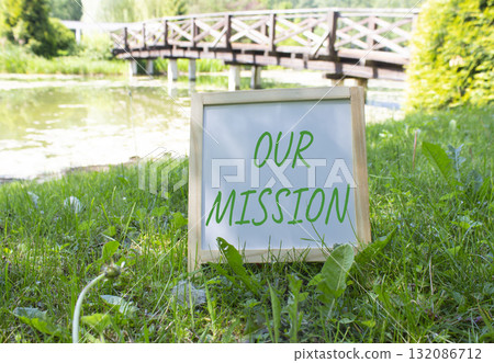 Our Mission symbol. Concept word Our Mission on white chalk blackboard. Beautiful meadow background with bridge. Business and Our Mission concept. Copy space. Our Mission symbol. Concept word Our Mission on white chalk blackboard. Beautiful meadow background with bridge. Business and Our Mission concept. Copy space. 132086712