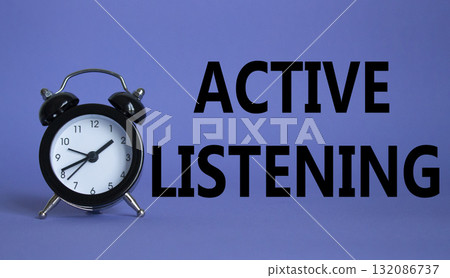 Active listening symbol. Beautiful purple background with alarm clock. Business and Active listening concept. Copy space. 132086737
