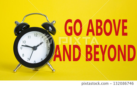 Go above and beyond symbol. Beautiful yellow background with alarm clock. Business and Go above and beyond concept. Copy space. 132086746