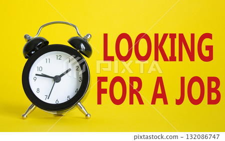 Looking for a job symbol. Beautiful yellow background with alarm clock. Business and Looking for a job concept. Copy space. 132086747