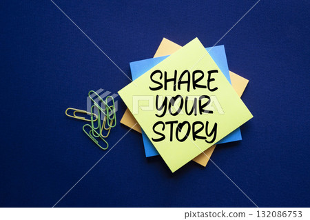 Share your story symbol. Sticky notes with words Share your story. Beautiful deep blue background. Business and Share your story concept. Copy space. 132086753