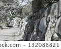 Rugged old stone walls surrounding the park path 132086821