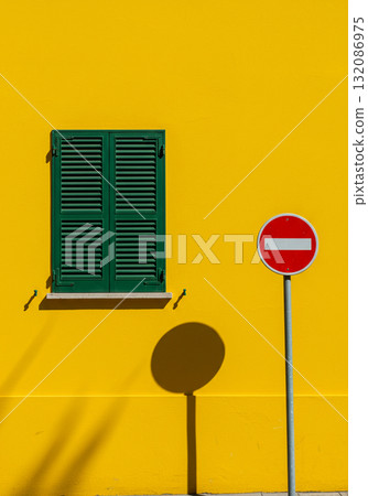 Yellow Wall with Green Shutters and No Entry Sign Yellow Wall with Green Shutters and No Entry Sign 132086975