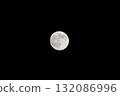 The harvest moon shining in the night sky 132086996