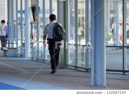 A male office worker walking to work around Kanazawa Station on a summer morning A male office worker walking to work around Kanazawa Station on a summer morning 132087145