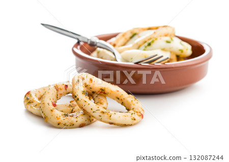 Marinated squid rings isolated on white background. 132087244