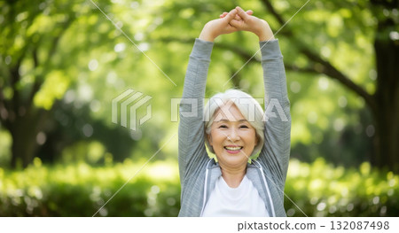 Senior woman stretching in the park 132087498