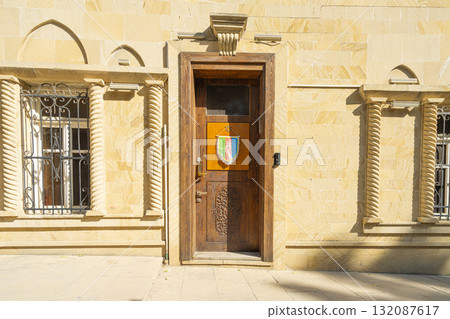 the Azerbaijani flag on the wooden door of a house in Baku, Azerbaijan 132087617