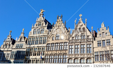 Ornate guildhalls lining Grote Markt in Antwerp, Belgium, historic architecture under clear blue sky Ornate guildhalls lining Grote Markt in Antwerp, Belgium, historic architecture under clear blue sky 132087646