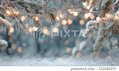 Stunning, magical winter holiday background. Snow-covered pine branches draped with fairy lights frame soft, blurred scene with golden bokeh lights. Perfect for Christmas, New Year, winter promotion 132088355