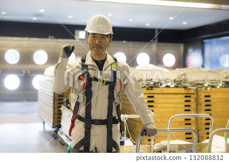 Worker wearing a full harness 132088832