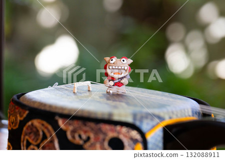 Shisa playing on the sanshin Shisa playing on the sanshin 132088911