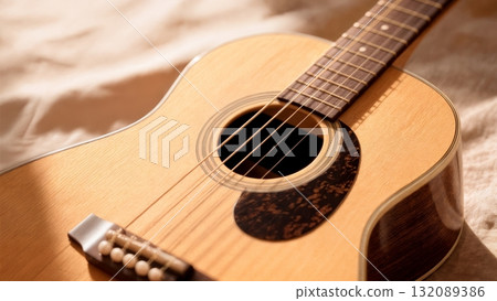 Acoustic Guitar Close-up with Warm Natural Light for Music Production and Creative Content 132089386