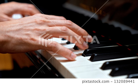 Hands Playing Piano Keys Close-up with Motion Blur for Music Learning and Education Content Hands Playing Piano Keys Close-up with Motion Blur for Music Learning and Education Content 132089441