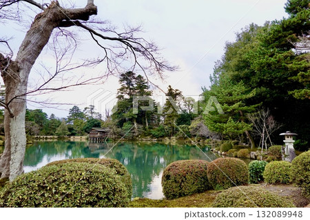 Kenrokuen Garden, with the Kotoji Lanterns of Kasumigaike Pond visible in the distance, Kanazawa City, Ishikawa Prefecture Kenrokuen Garden, with the Kotoji Lanterns of Kasumigaike Pond visible in the distance, Kanazawa City, Ishikawa Prefecture 132089948