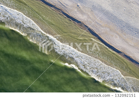 sandy beach on the seashore, view from above 132092151