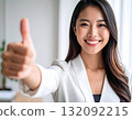 Young woman posing with thumbs up 132092215
