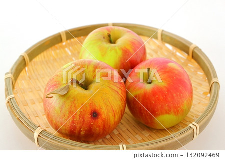 Apples in a bamboo basket on a white background Apples in a bamboo basket on a white background 132092469