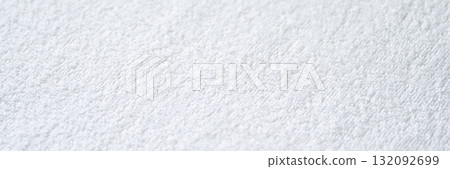 Close-up of white textured terry cloth fabric with soft and absorbent material 132092699