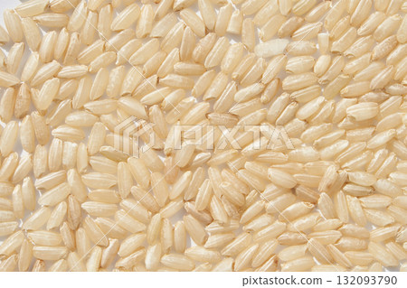 Close up view of uncooked brown rice grains texture with natural organic food 132093790