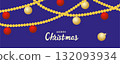Red and white striped Christmas balls hang on red satin ribbon with bow. 132093934