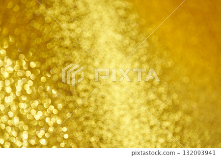 Abstract golden bokeh background with soft blurred light sparkles and glittering Abstract golden bokeh background with soft blurred light sparkles and glittering 132093941