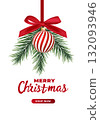 Red and white striped Christmas balls hang on red satin ribbon with bow. 132093946