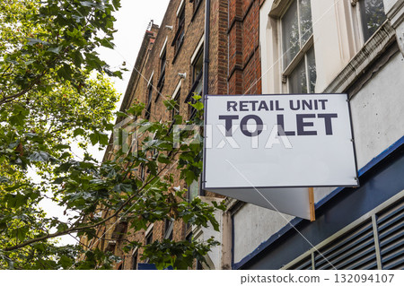 Retail Unit To Let sign on UK high street storefront, commercial property for rent 132094107