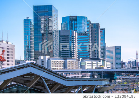 Tokyo cityscape in Japan. View of Shinagawa Station and office buildings. Takanawa Gateway Station is in the foreground. 132094193