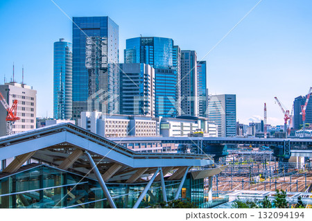 Tokyo cityscape in Japan. View of Shinagawa Station and office buildings. Takanawa Gateway Station is in the foreground. Tokyo cityscape in Japan. View of Shinagawa Station and office buildings. Takanawa Gateway Station is in the foreground. 132094194