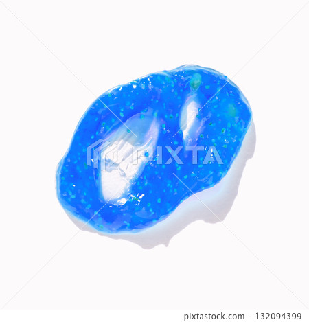 Close-up of blue gel blob with glossy texture against white background 132094399