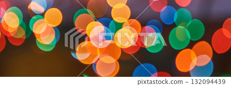 Vibrant out-of-focus multicolored lights in circular patterns creating Vibrant out-of-focus multicolored lights in circular patterns creating 132094439