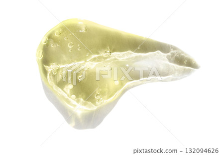 Translucent slice of yellow aloe vera with bubbles and white background 132094626
