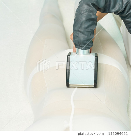 Female leg cellulite treatment with vacuum massage by spa professional 132094631